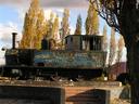 Puerto Natales main square and its grafitti-covered locomotive.